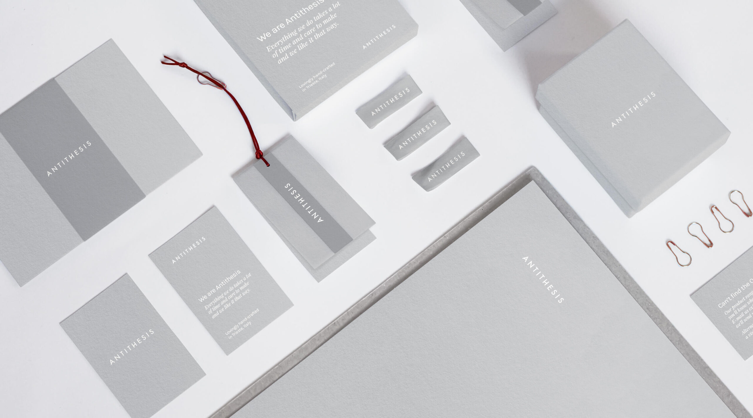 Overview of brand identity design featuring business cards, labels, swing tags, packaging and other printed collateral