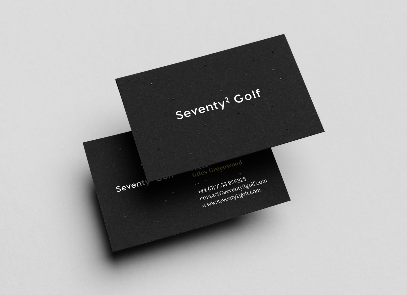 Front and back of a business card on top of one another, featuring logo and contact details